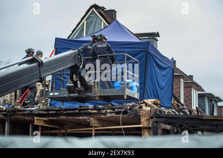 Nortorf, Germany. 04th Mar, 2021. Police personnel secure and investigate a destroyed end-terrace house after an explosion. In the row end house completely destroyed after an explosion the police found a body. Credit: Gregor Fischer/dpa/Alamy Live News Stock Photo