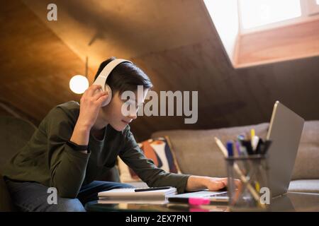 Little boy studying by group video call, use video conference with teacher, listening to online course. Using stationery, notebook. Easy, comfortable usage concept, education, online, childhood. Stock Photo