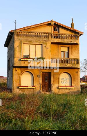 Winter Santander Cantabria Spain Early morning clear blue sky view of an old lived in dilapidated detached house in need of reformation Stock Photo