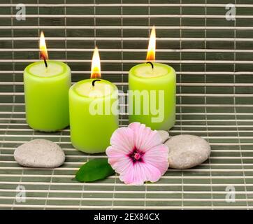 Candles, stones and flower Stock Photo