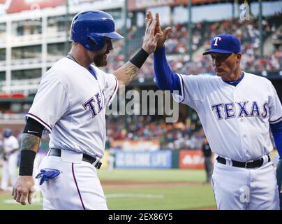 https://l450v.alamy.com/450v/2ex86y5/the-texas-rangers-josh-hamilton-left-is-congratulated-by-manager-jeff-banister-after-scoring-on-a-single-by-delino-deshields-against-the-new-york-yankees-in-the-second-inning-on-wednesday-july-29-2015-at-globe-life-park-in-arlington-texas-photo-by-jim-cowsertfort-worth-star-telegramtns-please-use-credit-from-credit-field-2ex86y5.jpg