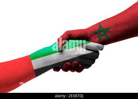 Handshake between United Arab Emirates and morocco flags painted on hands, illustration with clipping path. Stock Photo