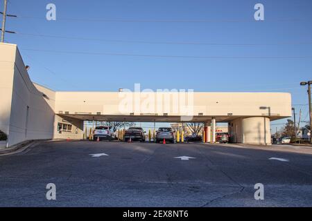Columbia County, Ga USA - 01 30 21: Wells Fargo bank teller drive thru with blue sky and car Stock Photo