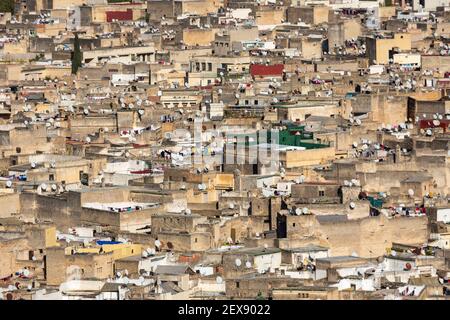 Cityscape view of rooftops and satellite dishes in the Fes medina, as seen from the terrace of Palais Faraj, Fes, Morocco Stock Photo
