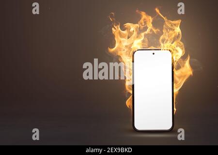 Blank smartphone on fire with copy space Stock Photo