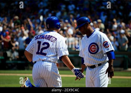 Chicago Cubs catcher Kyle Schwarber (12) between innings during a game  against the Atlanta Braves on July 18, 2015 in Atlanta, Georgia. The Cubs  defeated the Braves 4-0. (Tony Farlow/Four Seam Images