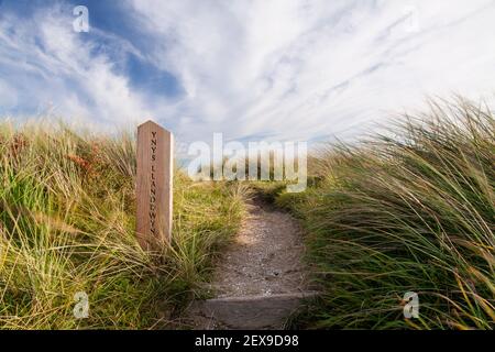 Signpost at Llanddwyn Island, Newborough Beach, Anglesey, North Wales Stock Photo