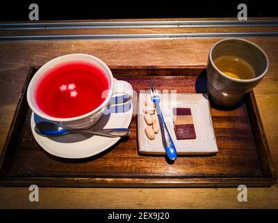 A high angle shot of Korean omija-cha, or magnolia berry tea on a wooden surface Stock Photo