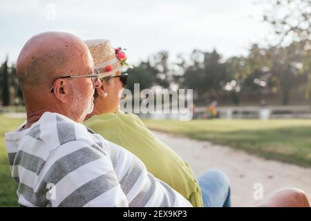 pensioners couple close-up sitting on a park  Stock Photo