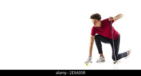 Handsome. Golf player in a red shirt isolated on white studio background, flyer with copyspace. Professional player practicing with emotions and facial expression. Sport, motion, action concept. Stock Photo