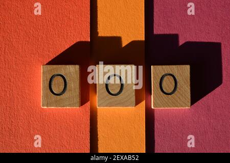 OOO Acronym for Out Of Office in wooden alphabet letters isolated on colourful background Stock Photo