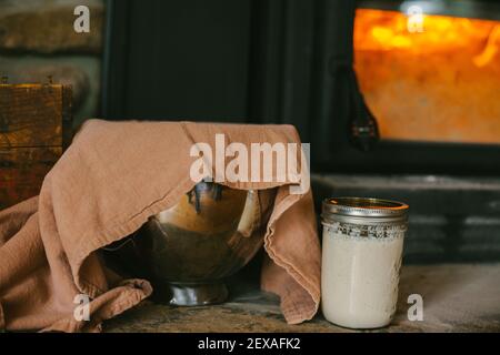 Sourdough Rising by a Warm Fire in the Winter Months Stock Photo
