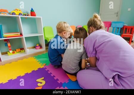 Educational group activity at the kindergarten or daycare Stock Photo