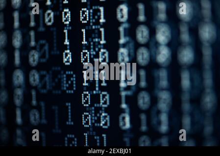abstract dark blue pixelated binary background with digits one and zero Stock Photo