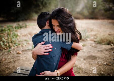 Expectant Mother Hugging Oldest Son in San Diego Stock Photo