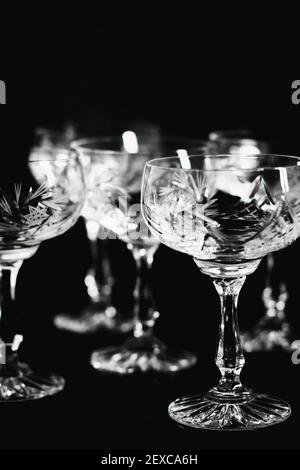Black and white image of empty vintage coupe glasses. Stock Photo