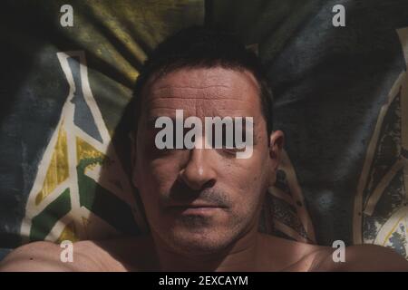 man in bed waking up in the morning, lazy days Stock Photo