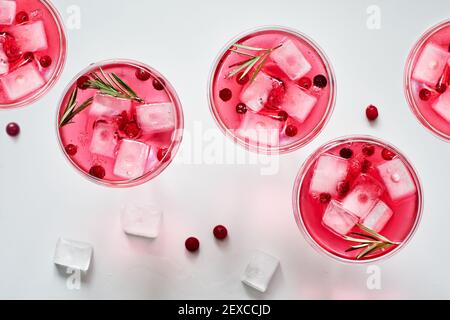 Cranberry rosemary spritzer drink on a light background. Stock Photo