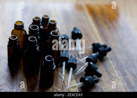 flat lay of empty glass amber dropper bottles Stock Photo