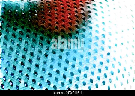 Macro shot of a mesh-like wavy red bright blue surface with holes Stock Photo