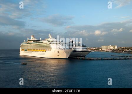 The sunset view of moored cruise ships in San Miguel resort town on Cozumel island (Mexico). Stock Photo