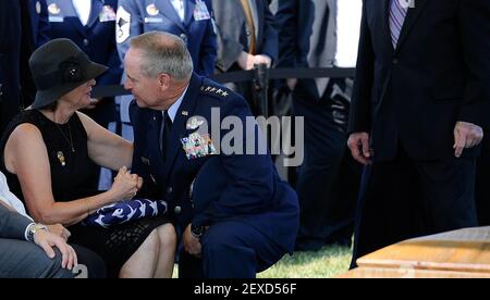 Air Force Chief of Staff Gen. Mark A. Welsh III comforts Jan Binnicker, widow of ninth Chief Master Sgt. of the Air Force James C. Binnicker, who was laid to rest in Arlington National Cemetery, Va., Aug. 14, 2015. Binnicker passed away March 21, in Calhoun, Ga. (Photo by Senior Airman Preston Webb/U.S. Air Force) *** Please Use Credit from Credit Field ***