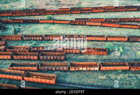 Aerial view of freight trains. Top view of old rusty wagons Stock Photo