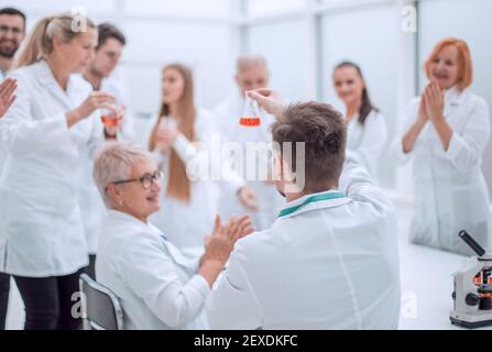 group of researchers discussing new ideas in the laboratory. Stock Photo