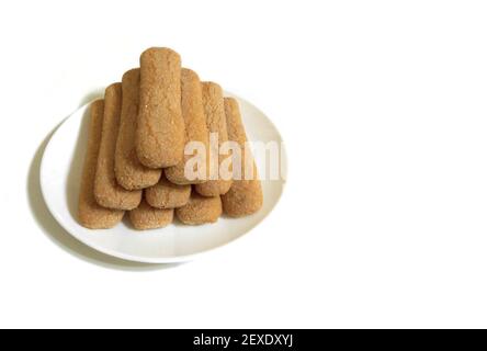 Sweet soft healthy soft spongy sprinkled sugar vanilla cookies (vainillas). Classic Argentine biscuits. White background. High angle shot. Copyspace Stock Photo
