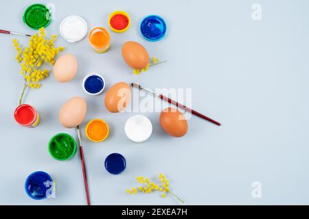Eggs and paints. Easter eggs decoration process. Stock Photo