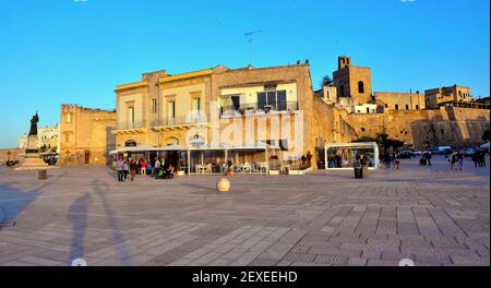 sunset and tourists on the promenade walk of the heroes  4 May 2018 Otranto Salento Italy Stock Photo