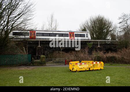 A Transport for Wales train crosses the Llynfi River at Pandy Park, Bridgend heading for Cardiff Central on the 4th March 2021. Credit: Lewis Mitchell Stock Photo