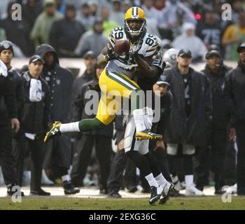 Green Bay, WI, USA. 30th Sep, 2018. Green Bay Packers linebacker James  Crawford #54 tackles Buffalo Bills running back Taiwan Jones #26 during the  NFL Football game between the Buffalo Bills and