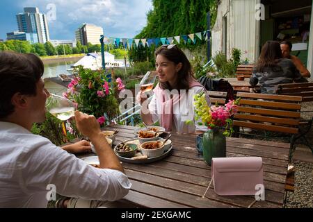 Couple eating in a restaurant on the banks of the Main, Frankfurt am Main, Hessen, Germany. Stock Photo