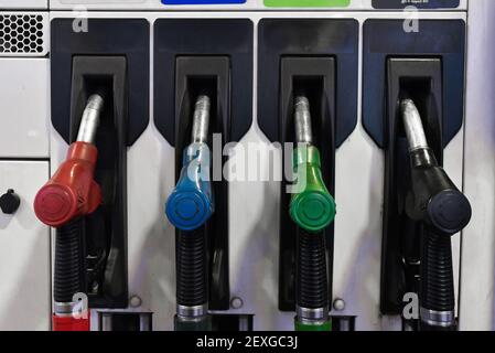 Fuel pump nozzle seen at a gas station. Stock Photo