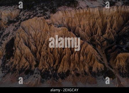 Aerial panorama view of Arriba Fossil da Praia da Gale Fontainhas beach hoodoo fairy chimney earth pyramid rock formations canyon erosion, atlantic oc Stock Photo