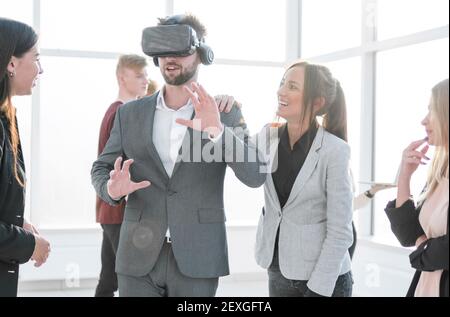 designer is testing a virtual reality helmet in the new office Stock Photo