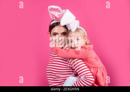 Happy Easter. Girls with bunny ears. Egg hunt. Traditional spring holiday. Stock Photo