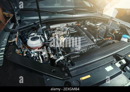 View under Car Hood of Modern turbocharged eco-friendly engine or motor. Stock Photo