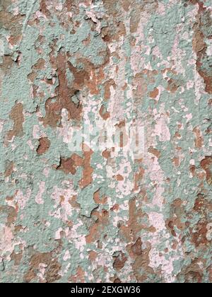 Old shabby plaster wall painted green texture background Stock Photo