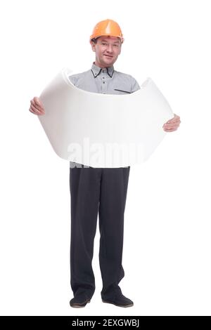 male architect in a protective helmet reading blueprints. Stock Photo