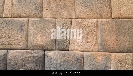 snakes carved on stone wall in cusco imperial city, Peru Stock Photo