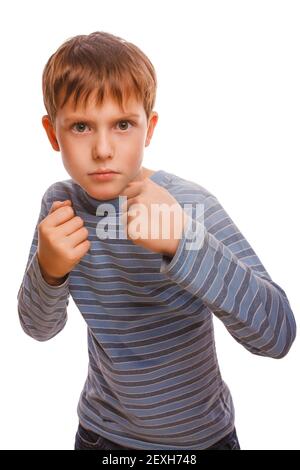 Bad bully child boy blond  angry aggressive fights in striped sh Stock Photo