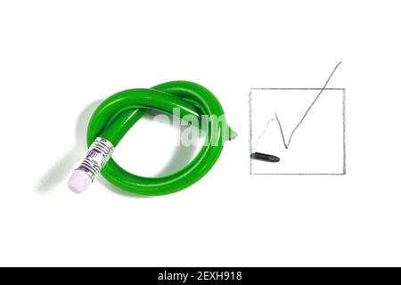 Green pencil has been knotted during voting on the paper. Symbolic concept of disagreeing and emotions Stock Photo