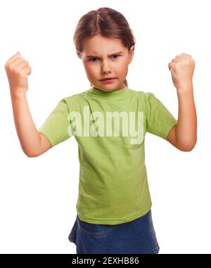 Angry child evil girl shows fists experiencing anger and isolate Stock Photo