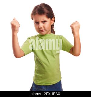 Angry evil girl shows fists experiencing anger Stock Photo