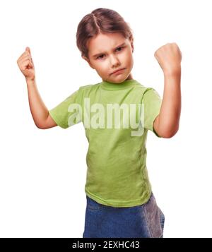 Angry evil girl female child shows fists experiencing anger and Stock Photo