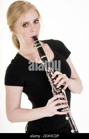 Pretty Blond Woman Playing Clarinet Musical Performance White Background Stock Photo