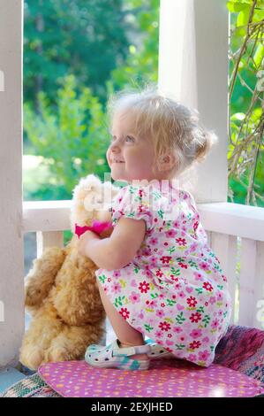 Cute little girl with teddy bear Stock Photo