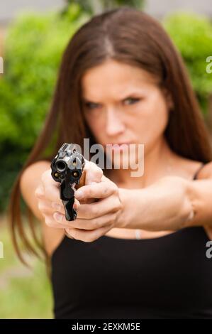 Angry Beautiful Brunette Woman Points Loaded Handgun Self Defense Stock Photo